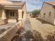 Exterior view of a walkway between two single story homes with desert landscaping at 2704 Willow Wren Dr, North Las Vegas, NV 89084