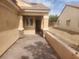 View of an outdoor sitting area in between two homes with paver flooring at 2704 Willow Wren Dr, North Las Vegas, NV 89084