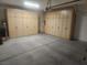 Spacious garage equipped with wall-to-wall storage cabinets for optimal organization at 2704 Willow Wren Dr, North Las Vegas, NV 89084