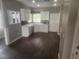 Bright kitchen featuring white cabinets, sleek countertops, and stainless appliances at 2704 Willow Wren Dr, North Las Vegas, NV 89084