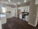 Modern kitchen with stainless steel appliances and sleek white cabinetry at 2704 Willow Wren Dr, North Las Vegas, NV 89084