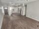 Open-concept living space seamlessly connects kitchen and front entrance with laminate floors at 2704 Willow Wren Dr, North Las Vegas, NV 89084