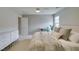 Neutral bedroom with large bed, bedside tables, modern decor, ensuite door and dresser at 2878 Starling Summit St, Henderson, NV 89044