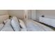 Bedroom with serene decor, comfy bed, ensuite door and dresser at 2878 Starling Summit St, Henderson, NV 89044