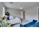 Bright bedroom features plush bedding, a modern ceiling fan, and stylish decor accents at 2878 Starling Summit St, Henderson, NV 89044