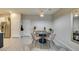 Cozy dining area with a round table, wicker chairs, and modern decor at 2878 Starling Summit St, Henderson, NV 89044