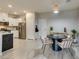 Bright dining area with stainless steel appliances, a round table, and four chairs at 2878 Starling Summit St, Henderson, NV 89044