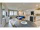 Bright, open floor plan with a dining area, modern kitchen, and comfortable living space at 2878 Starling Summit St, Henderson, NV 89044
