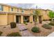 Stylish townhome showcasing a covered porch, xeriscaping, and close proximity to community amenities at 2878 Starling Summit St, Henderson, NV 89044
