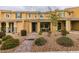 Inviting townhome featuring a cozy covered porch, low maintenance landscaping and a tiled roof at 2878 Starling Summit St, Henderson, NV 89044
