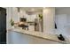 Well-lit kitchen featuring white cabinets, stainless steel appliances, and sleek granite countertops at 2878 Starling Summit St, Henderson, NV 89044