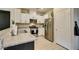 Contemporary kitchen design equipped with stainless steel appliances and light granite countertops at 2878 Starling Summit St, Henderson, NV 89044