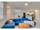 Cozy living room with a comfortable blue sofa, stylish decor, and plenty of natural light at 2878 Starling Summit St, Henderson, NV 89044