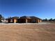 Exterior of home under construction with exposed framework and blue sky at 2881 Red Rock Dr, Pahrump, NV 89048
