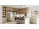 Well-lit kitchen featuring modern stainless steel appliances and breakfast bar seating at 2881 Red Rock Dr, Pahrump, NV 89048