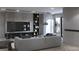 Modern living room with comfortable seating, built-in shelving, and stylish decor at 2881 Red Rock Dr, Pahrump, NV 89048