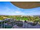 Relaxing balcony with seating offering panoramic views of the city and lush greenery at 3111 Bel Air Dr # 10F, Las Vegas, NV 89109