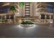 Elegant building entrance featuring lush landscaping and prominent signage, 'Regency Towers' at 3111 Bel Air Dr # 10F, Las Vegas, NV 89109