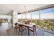 Dining room with a modern table, chairs, large windows and city views, perfect for entertaining or Gathering meals at 3111 Bel Air Dr # 10F, Las Vegas, NV 89109
