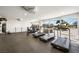 Well-equipped gym with treadmills, punching bag, and panoramic windows offering city views at 3111 Bel Air Dr # 10F, Las Vegas, NV 89109