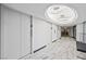 Elegant hallway featuring marble floors, recessed lighting, and elevator access for convenient living at 3111 Bel Air Dr # 10F, Las Vegas, NV 89109