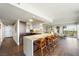 Contemporary kitchen featuring an island with bar seating, modern appliances, and ample cabinet space at 3111 Bel Air Dr # 10F, Las Vegas, NV 89109