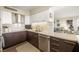Modern kitchen with stainless steel appliances, two-tone cabinetry, ample counter space, and stylish fixtures at 3111 Bel Air Dr # 10F, Las Vegas, NV 89109