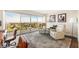 Bright living room with floor to ceiling windows, balcony access, and a cozy seating area at 3111 Bel Air Dr # 10F, Las Vegas, NV 89109