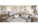 Bright living room featuring a large sectional sofa, modern decor, and hardwood floors, creating a welcoming space at 3111 Bel Air Dr # 10F, Las Vegas, NV 89109