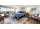 Spacious main bedroom featuring floor-to-ceiling windows, a seating area, and hardwood floors at 3111 Bel Air Dr # 10F, Las Vegas, NV 89109