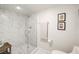 Elegant marble tiled shower with a glass door, rainfall showerhead, and modern fixtures at 3111 Bel Air Dr # 10F, Las Vegas, NV 89109