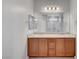 Bathroom featuring a double vanity with granite countertops and modern lighting at 378 Hellebores Ave, North Las Vegas, NV 89084