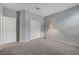 Comfortable bedroom with carpet flooring, closet, and reading lamp at 378 Hellebores Ave, North Las Vegas, NV 89084