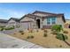 Attractive single-story home with low-maintenance desert landscaping and a convenient two-car garage at 378 Hellebores Ave, North Las Vegas, NV 89084
