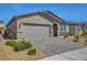 A well-maintained single-story home with a two-car garage and appealing desert landscaping at 378 Hellebores Ave, North Las Vegas, NV 89084