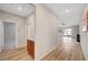 Open hallway with modern flooring, connecting bedrooms, living spaces, and a charming bar area at 378 Hellebores Ave, North Las Vegas, NV 89084