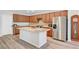 Beautiful kitchen with a central island, stainless steel appliances, and custom cabinetry at 378 Hellebores Ave, North Las Vegas, NV 89084