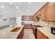 Beautiful kitchen featuring stone countertops, stainless steel appliances, and natural wood cabinets at 378 Hellebores Ave, North Las Vegas, NV 89084