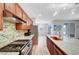 Modern kitchen featuring stainless steel appliances, granite countertops, and stylish backsplash at 378 Hellebores Ave, North Las Vegas, NV 89084