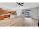 Spacious living area showcasing modern flooring, a stylish kitchen, and sliding doors to the backyard at 378 Hellebores Ave, North Las Vegas, NV 89084