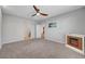 Spacious main bedroom featuring plush carpeting and a cozy fireplace at 378 Hellebores Ave, North Las Vegas, NV 89084