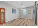 Cozy room featuring wood-look floors, stylish light fixtures, and soft neutral walls at 378 Hellebores Ave, North Las Vegas, NV 89084