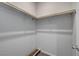 A walk-in closet featuring dual wooden rods and an adaptable layout to meet storage needs at 378 Hellebores Ave, North Las Vegas, NV 89084