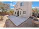 Home backyard featuring large patio and a view of the home's exterior and nearby greenery at 5100 Amethyst Creek Ct, Las Vegas, NV 89131