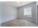 Clean bedroom with neutral tones, carpet, a window with blinds, and closet access at 5100 Amethyst Creek Ct, Las Vegas, NV 89131