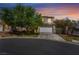 Charming two-story home with a well-manicured lawn and attached two-car garage at 5100 Amethyst Creek Ct, Las Vegas, NV 89131