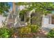Charming home featuring stucco exterior, arched entryway, and professionally landscaped front yard at 5100 Amethyst Creek Ct, Las Vegas, NV 89131