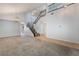 Open-concept living space with carpet, tile flooring, staircase and bright natural light at 5100 Amethyst Creek Ct, Las Vegas, NV 89131