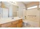 Bathroom featuring neutral walls, tiled floors, and a shower-tub combo at 5127 Fiji Island Ct, North Las Vegas, NV 89031