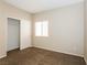 Comfortable bedroom with neutral walls and carpeting, featuring a closet with sliding doors at 5127 Fiji Island Ct, North Las Vegas, NV 89031